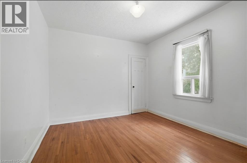 Main bedroom with hardwood flooring - 188 Troy Street, Mississauga, ON - Indoor Photo Showing Other Room