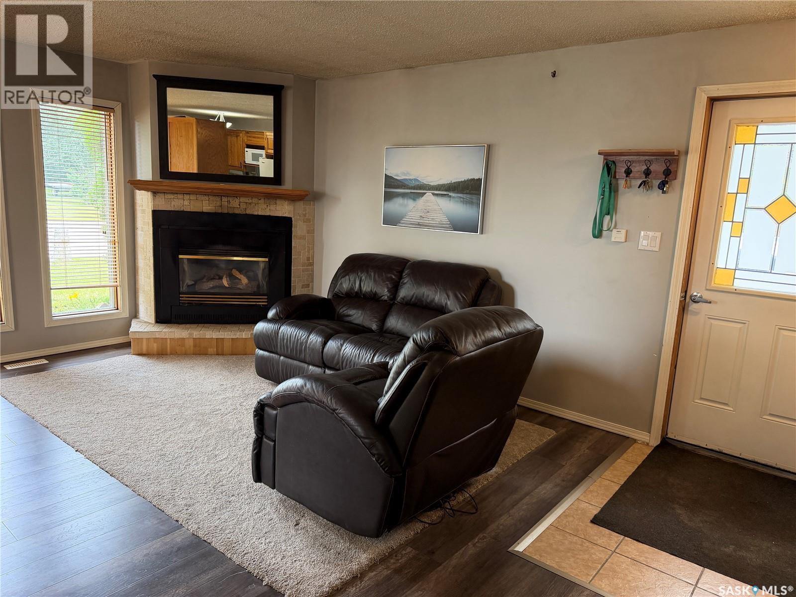 202 1St Street E, Turtleford, SK - Indoor Photo Showing Living Room With Fireplace