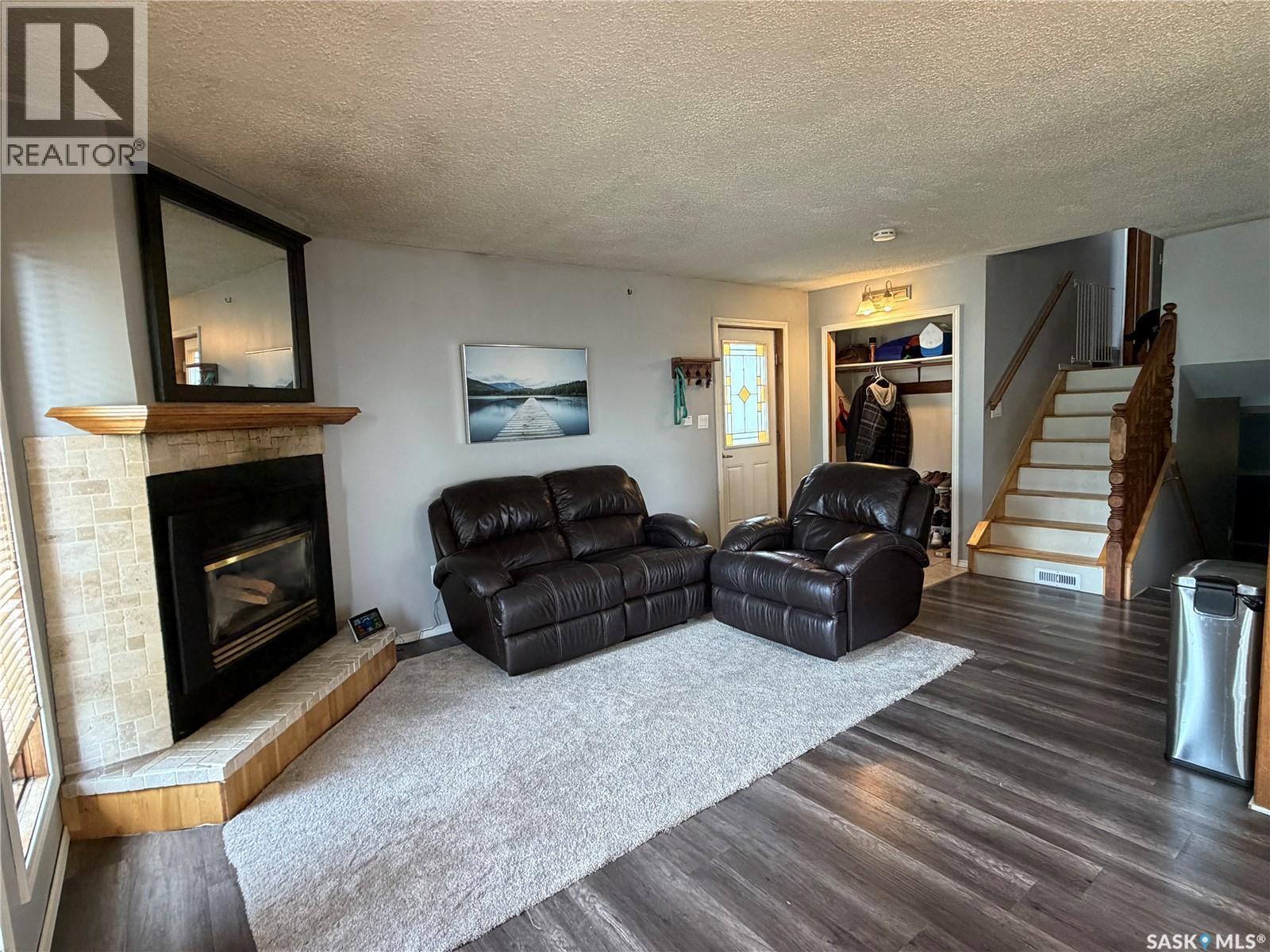 202 1St Street E, Turtleford, SK - Indoor Photo Showing Living Room With Fireplace