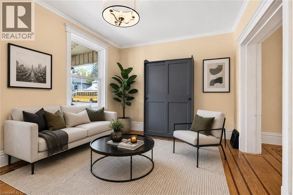 This image has been virtually staged - 520 John Street N, Hamilton, ON - Indoor Photo Showing Living Room