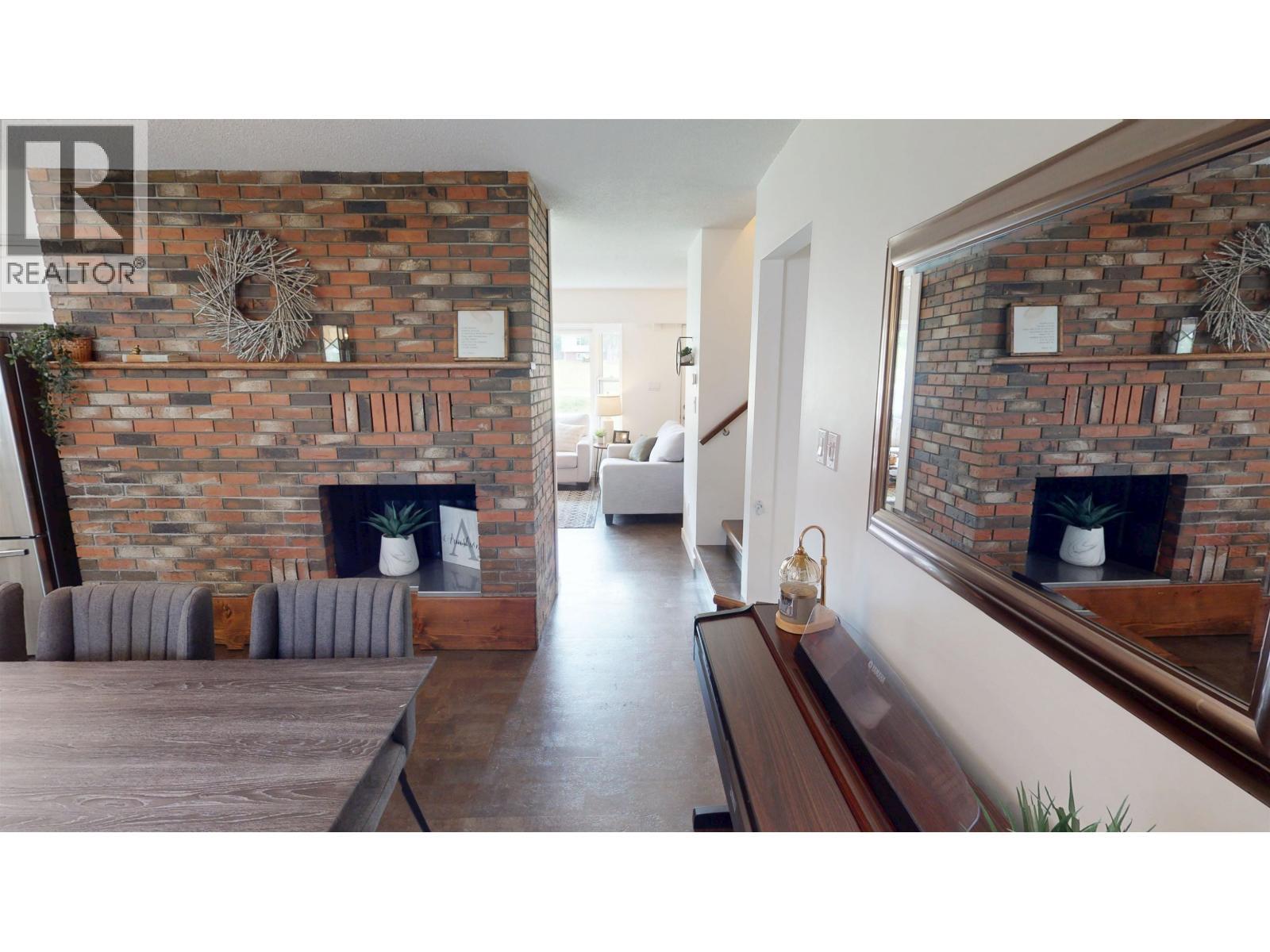115 S Brears Road, Quesnel, BC - Indoor Photo Showing Living Room With Fireplace