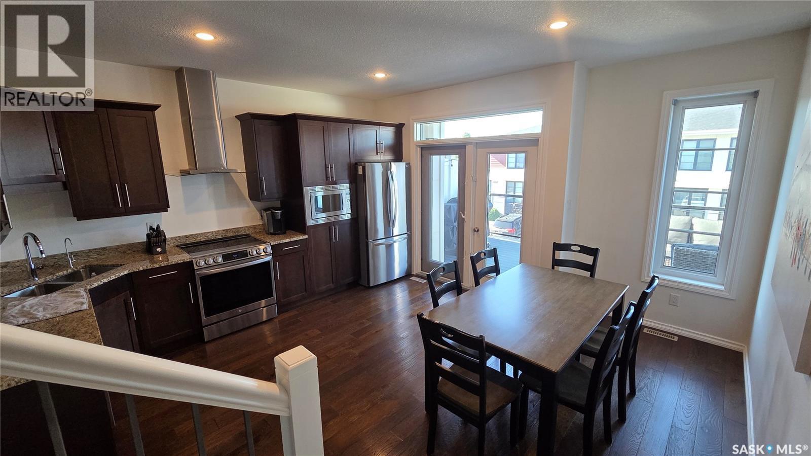 204 3229 Elgaard Drive, Regina, SK - Indoor Photo Showing Kitchen With Stainless Steel Kitchen With Double Sink