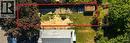 Expansive rectangular lot featuring established trees, a concrete pad, and a storage shed - 128 Auburn Avenue, Hamilton, ON 