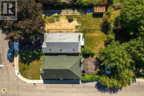 Aerial view showcasing two residential properties with distinct roofing styles - 128 Auburn Avenue, Hamilton, ON 