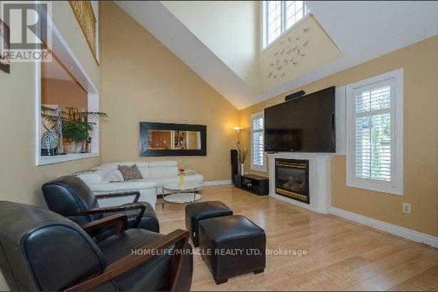 30 Masters Green Crescent, Brampton, ON - Indoor Photo Showing Living Room With Fireplace