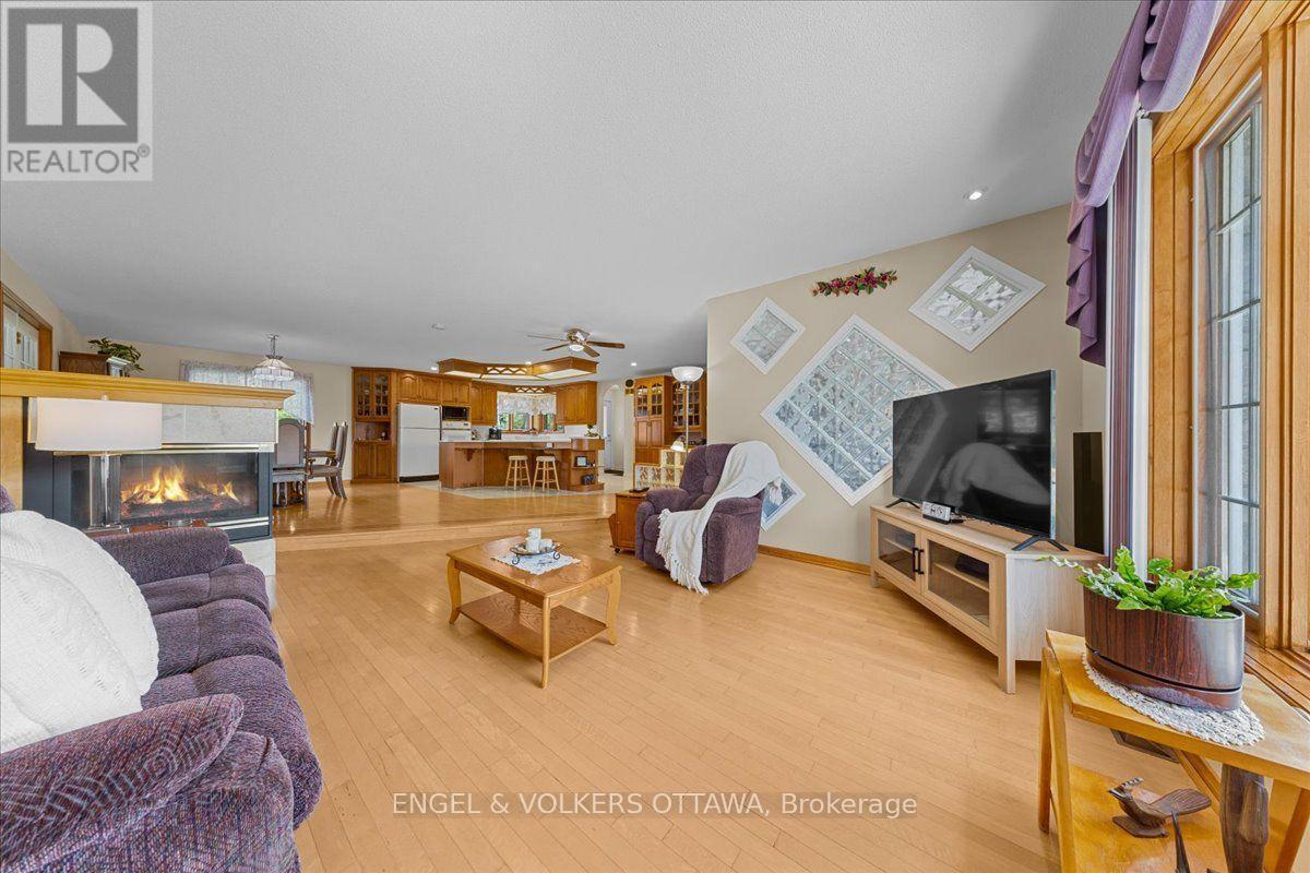 3805 Big Rideau Lake Road, Rideau Lakes, ON - Indoor Photo Showing Living Room With Fireplace