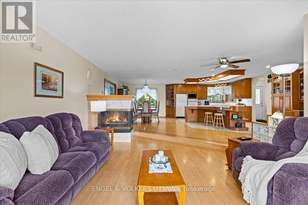3805 Big Rideau Lake Road, Rideau Lakes, ON - Indoor Photo Showing Living Room With Fireplace