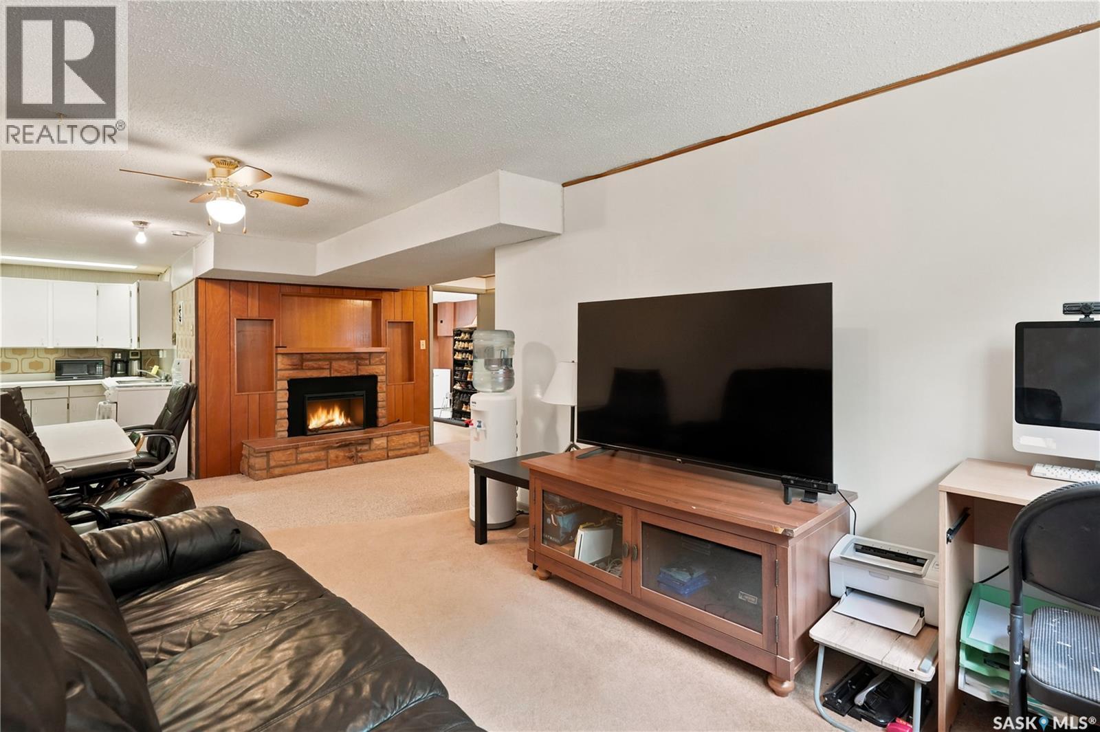 7343 8Th Avenue, Regina, SK - Indoor Photo Showing Other Room With Fireplace