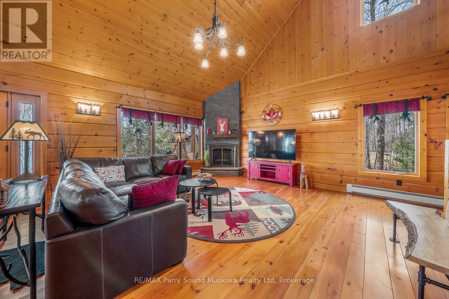48 Wendy'S Lane, Mckellar, ON - Indoor Photo Showing Living Room With Fireplace