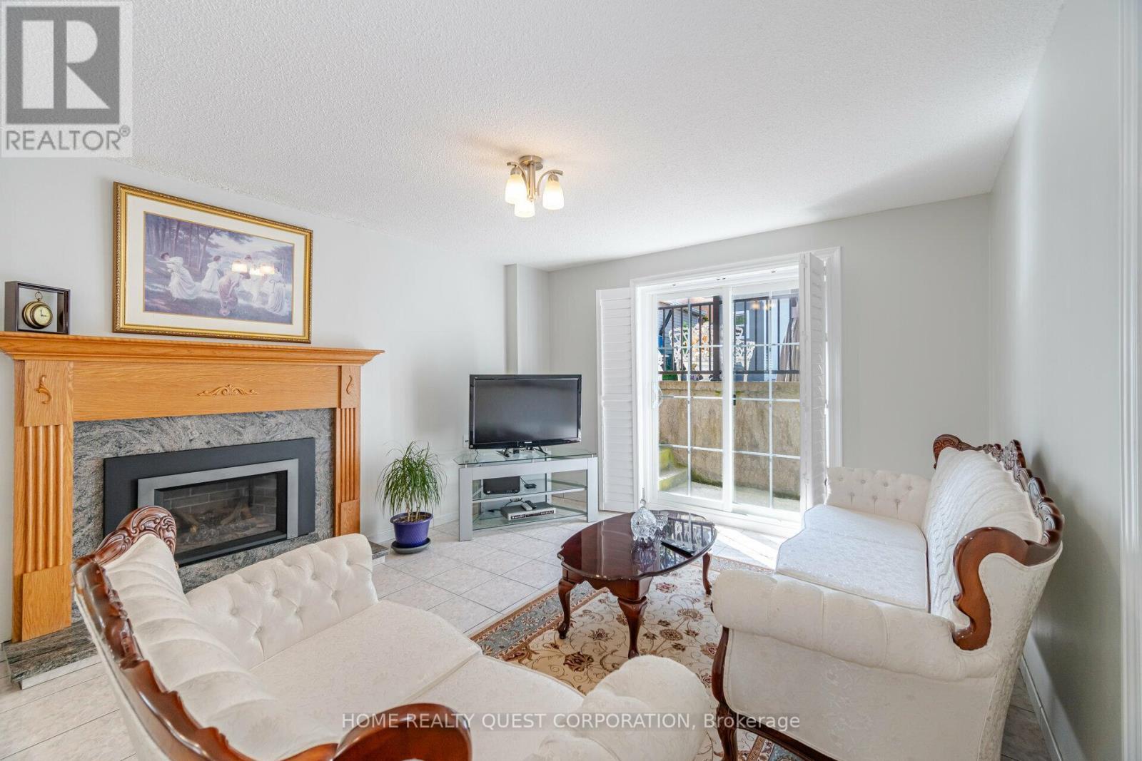Separate Entrance from Basement (back of house) - 4190 Bishopstoke Lane, Mississauga, ON - Indoor Photo Showing Living Room With Fireplace