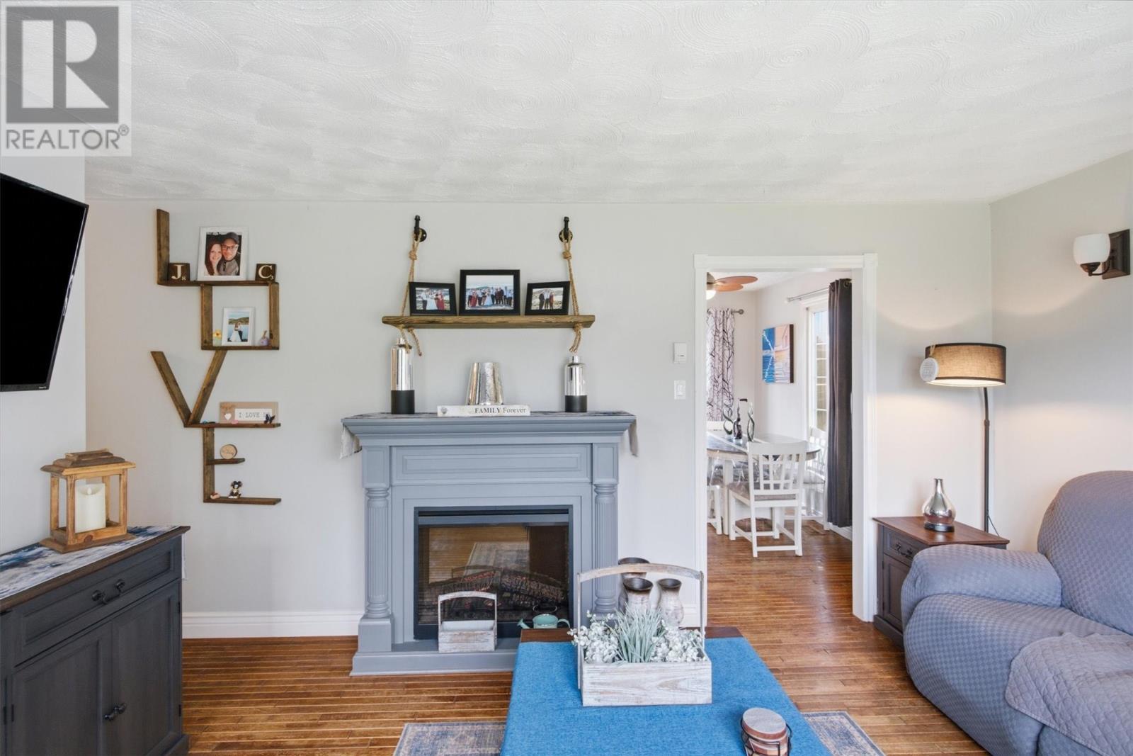 11 Pine Crescent, Birchy Bay, NL - Indoor Photo Showing Living Room With Fireplace