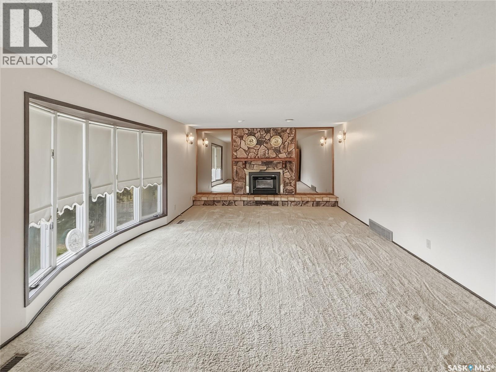 512 1St Street N, Cabri, SK - Indoor Photo Showing Living Room With Fireplace