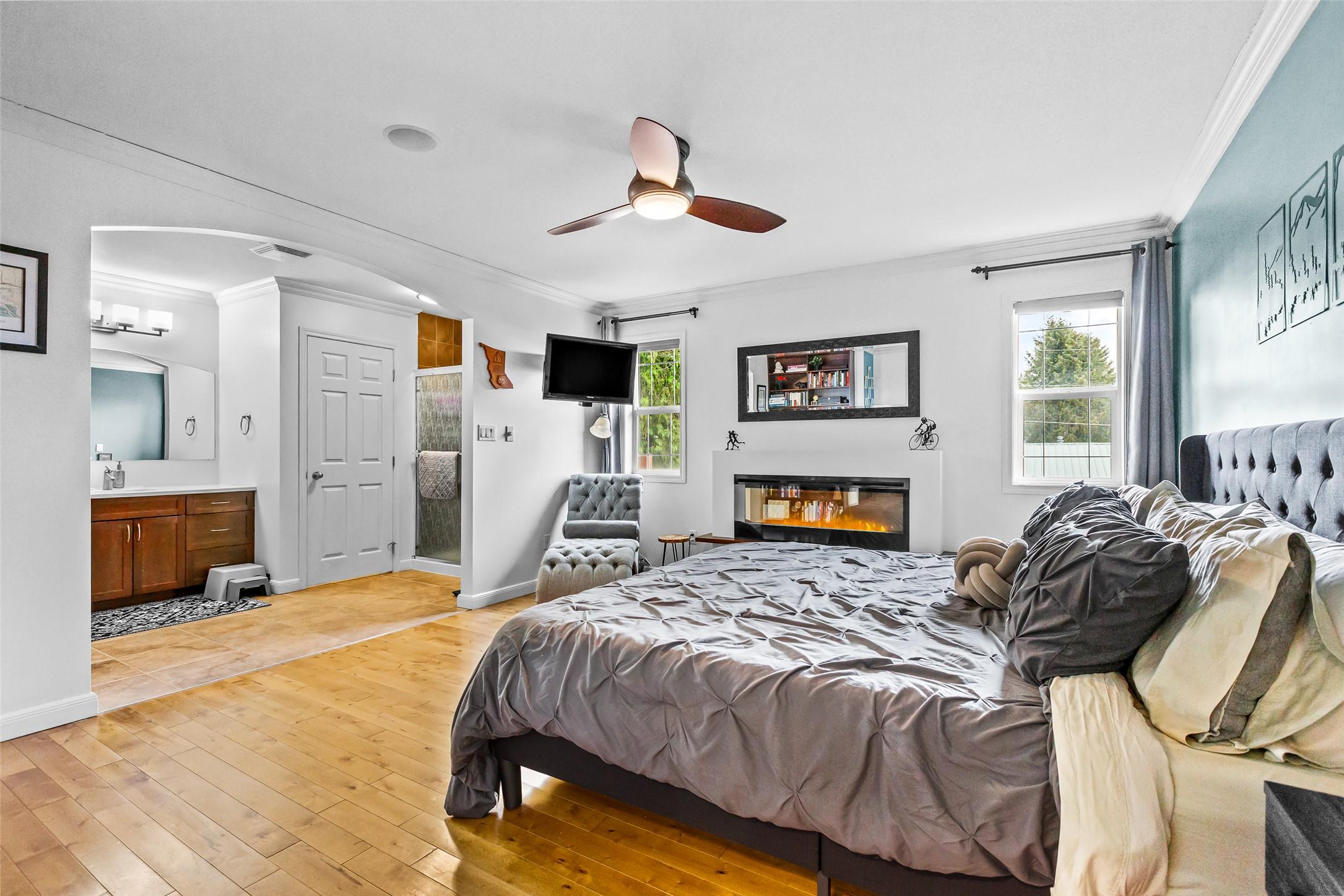 1901 Alder Street, Creston, BC - Indoor Photo Showing Bedroom With Fireplace