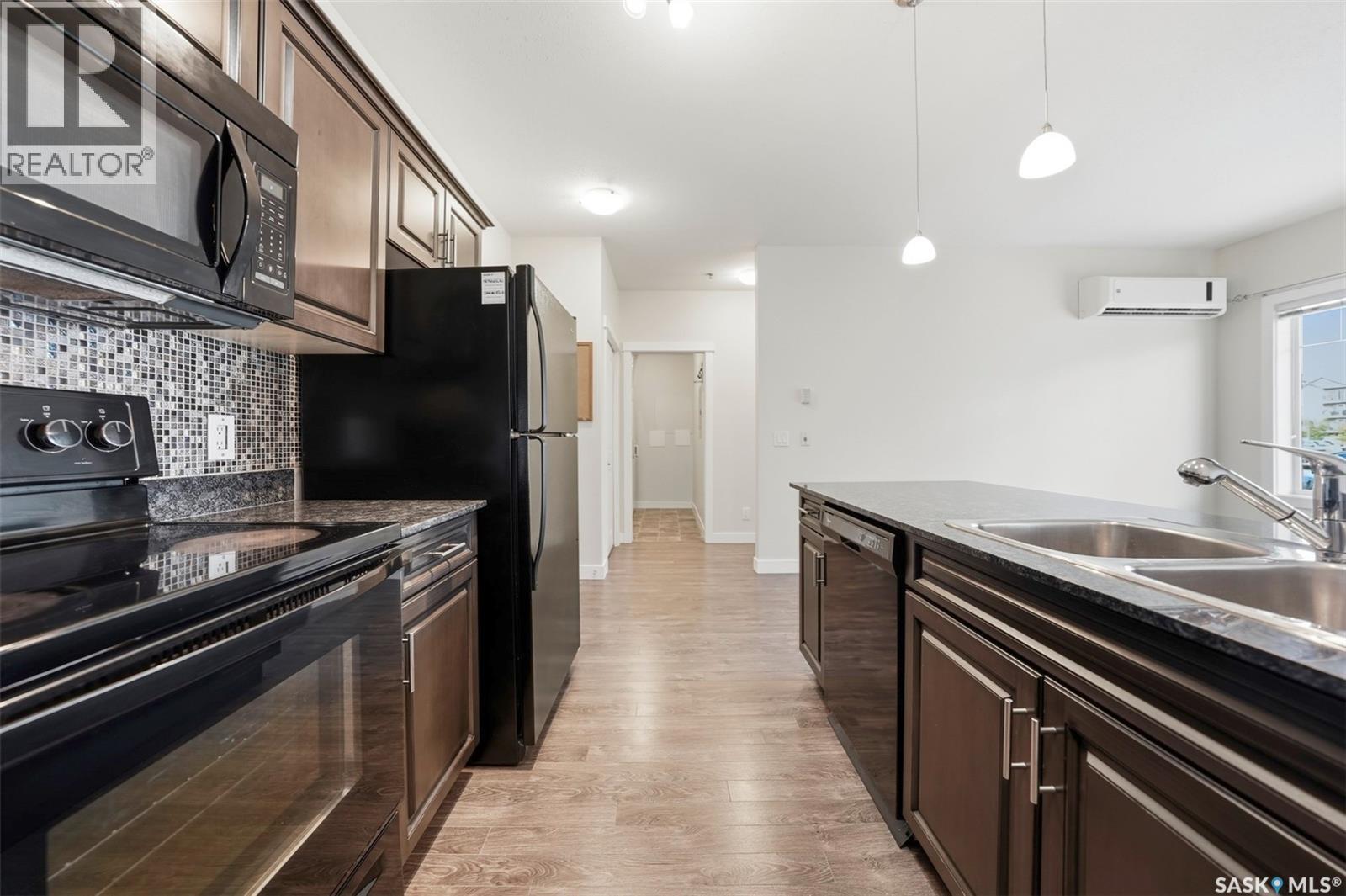 104 714 Hart Road, Saskatoon, SK - Indoor Photo Showing Kitchen With Double Sink