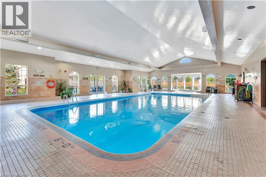21 Cathy Drive, Mount Hope, ON - Indoor Photo Showing Other Room With In Ground Pool