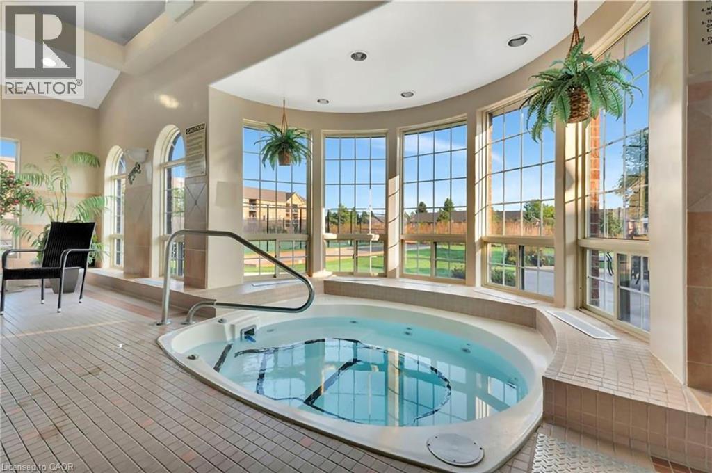 21 Cathy Drive, Mount Hope, ON - Indoor Photo Showing Other Room With In Ground Pool