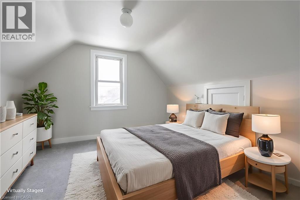 Attic space with sloped ceilings and a single window - 156 Adeline Avenue, Hamilton, ON