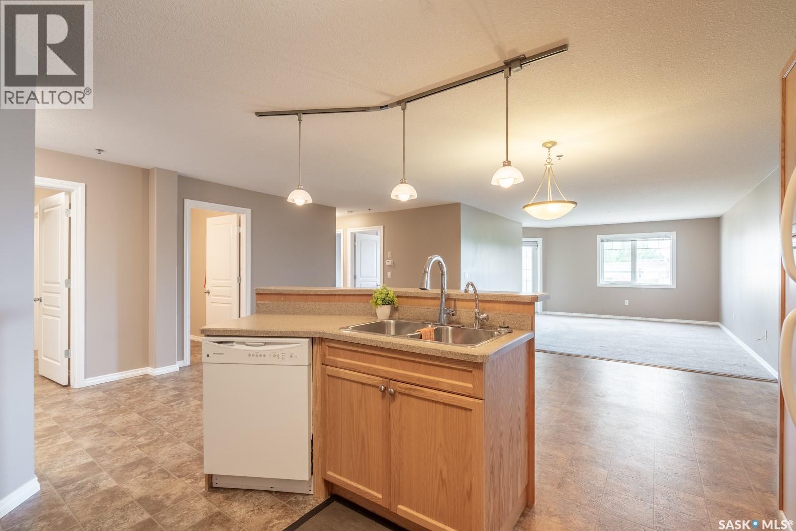 108 6345 Rochdale Boulevard, Regina, SK - Indoor Photo Showing Kitchen With Double Sink