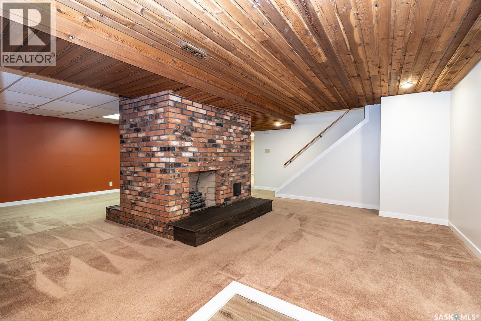 350 Guelph Crescent, Saskatoon, SK - Indoor Photo Showing Other Room With Fireplace