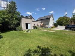 View from the rear showing large attached shed. - 