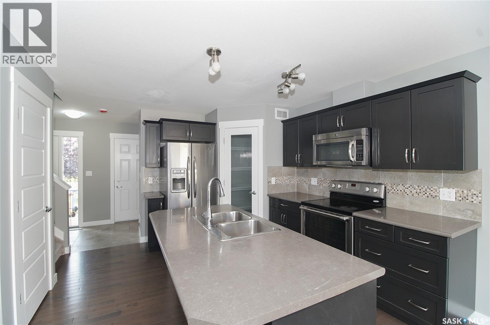 4541 Green Rock Road, Regina, SK - Indoor Photo Showing Kitchen With Stainless Steel Kitchen With Double Sink With Upgraded Kitchen