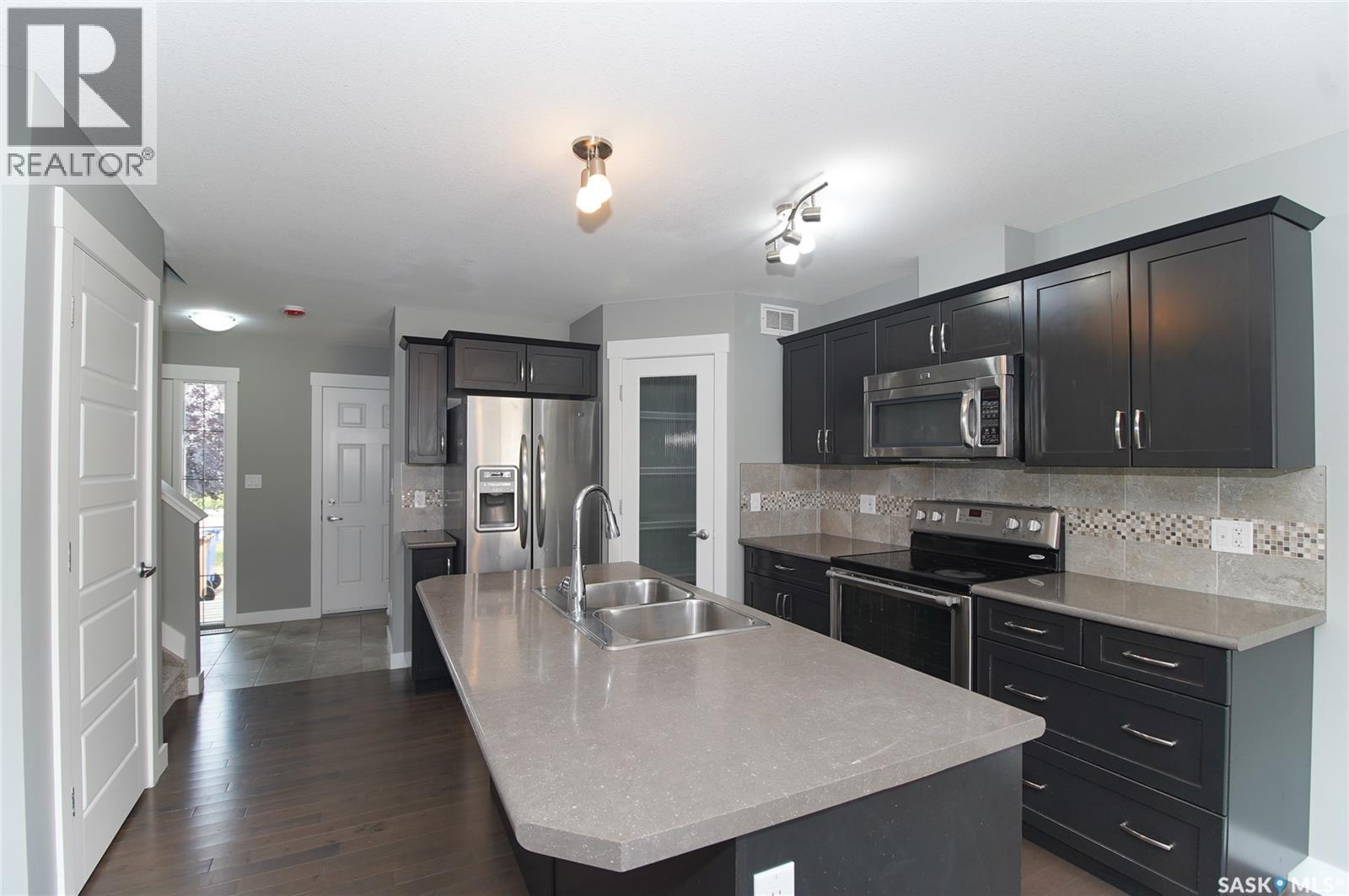 4541 Green Rock Road, Regina, SK - Indoor Photo Showing Kitchen With Stainless Steel Kitchen With Double Sink With Upgraded Kitchen