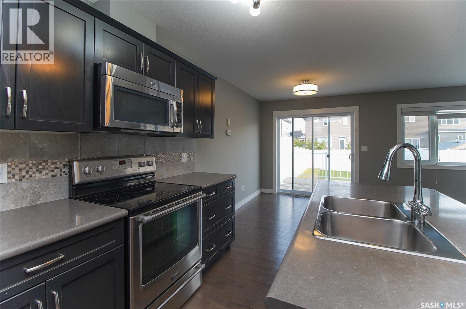 4541 Green Rock Road, Regina, SK - Indoor Photo Showing Kitchen With Double Sink
