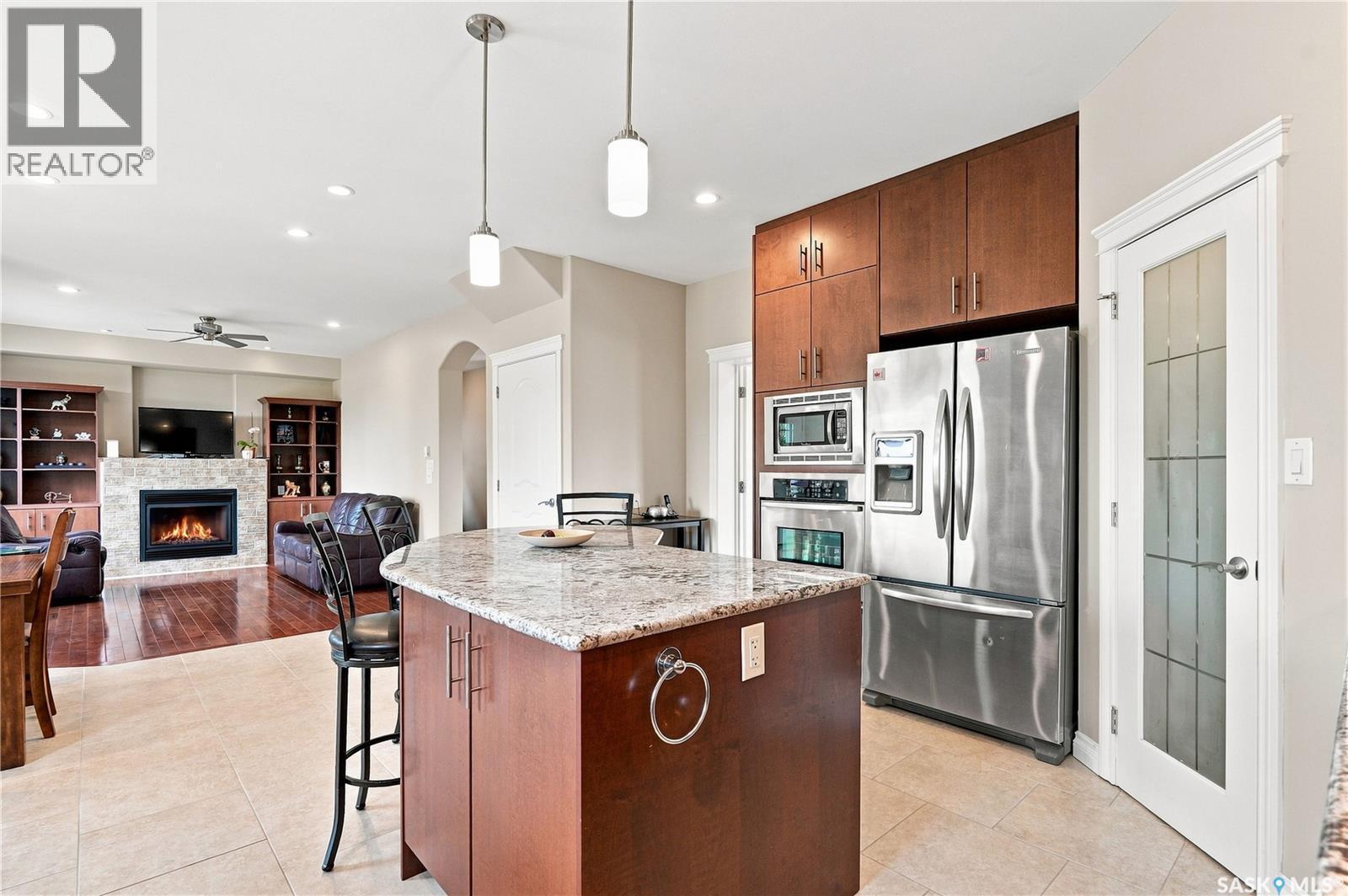 315 Waters Crescent, Saskatoon, SK - Indoor Photo Showing Kitchen With Fireplace With Stainless Steel Kitchen With Upgraded Kitchen