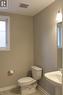 Bathroom featuring a white toilet, pedestal sink, ceramic tile flooring, and a single window - 31 Pointer Street Unit# Main Floor, Cambridge, ON  - Indoor Photo Showing Bathroom 