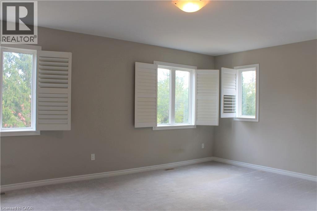 Neutral wall tones with white trim throughout - 31 Pointer Street Unit# Main Floor, Cambridge, ON - Indoor Photo Showing Other Room