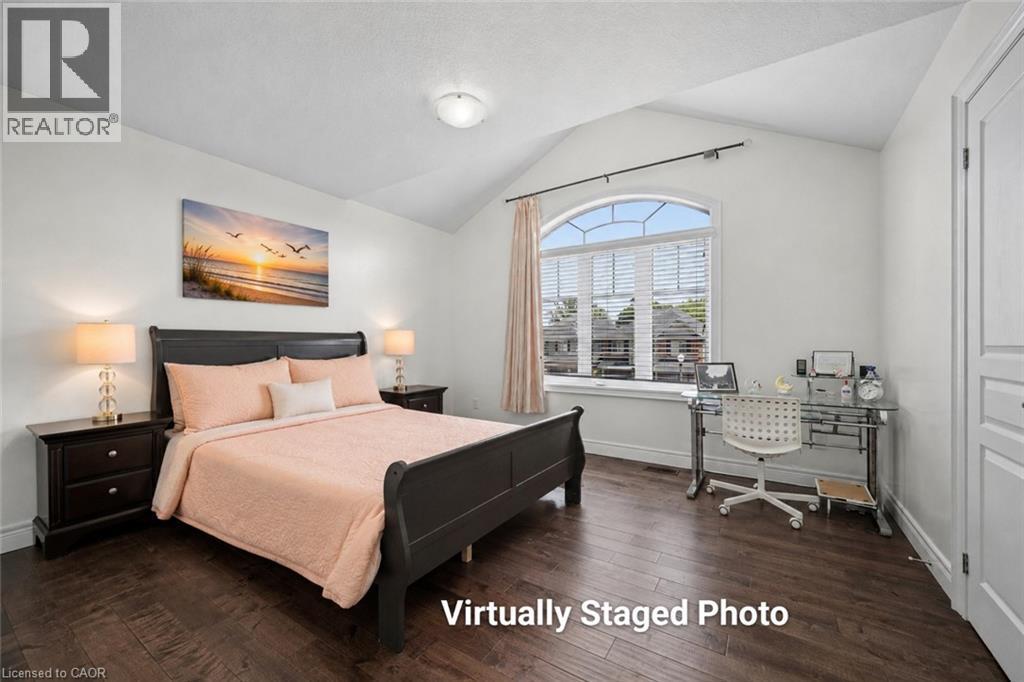 Bedroom featuring wood-finish flooring and a vaulted ceiling - 145 Redtail Street, Kitchener, ON - Indoor Photo Showing Bedroom