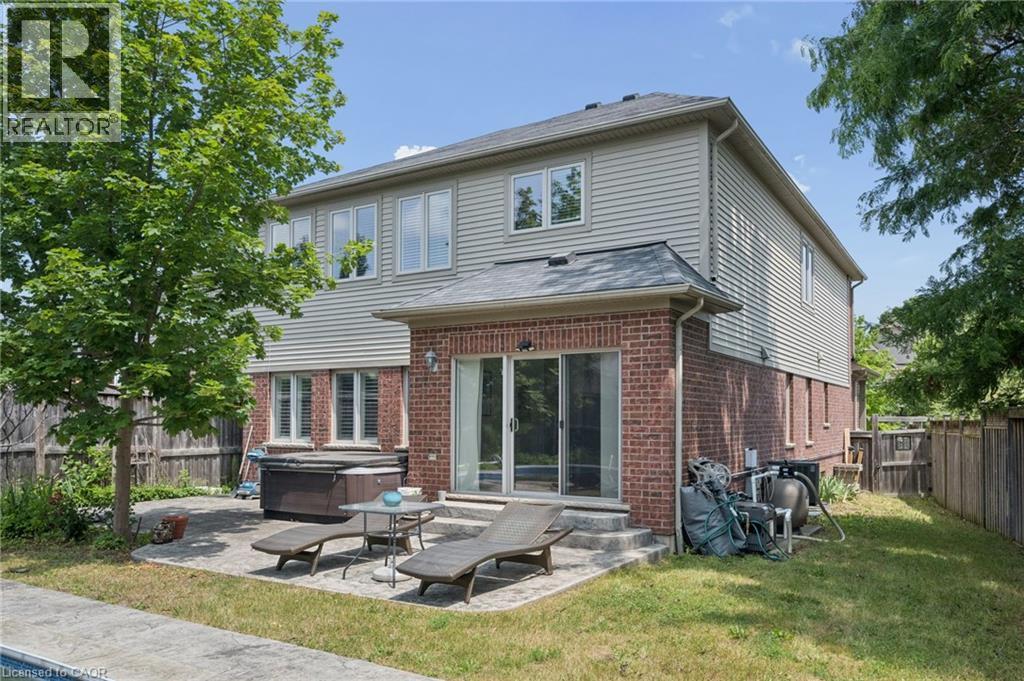 Brick and siding exterior with multiple windows - 145 Redtail Street, Kitchener, ON - Outdoor With Deck Patio Veranda