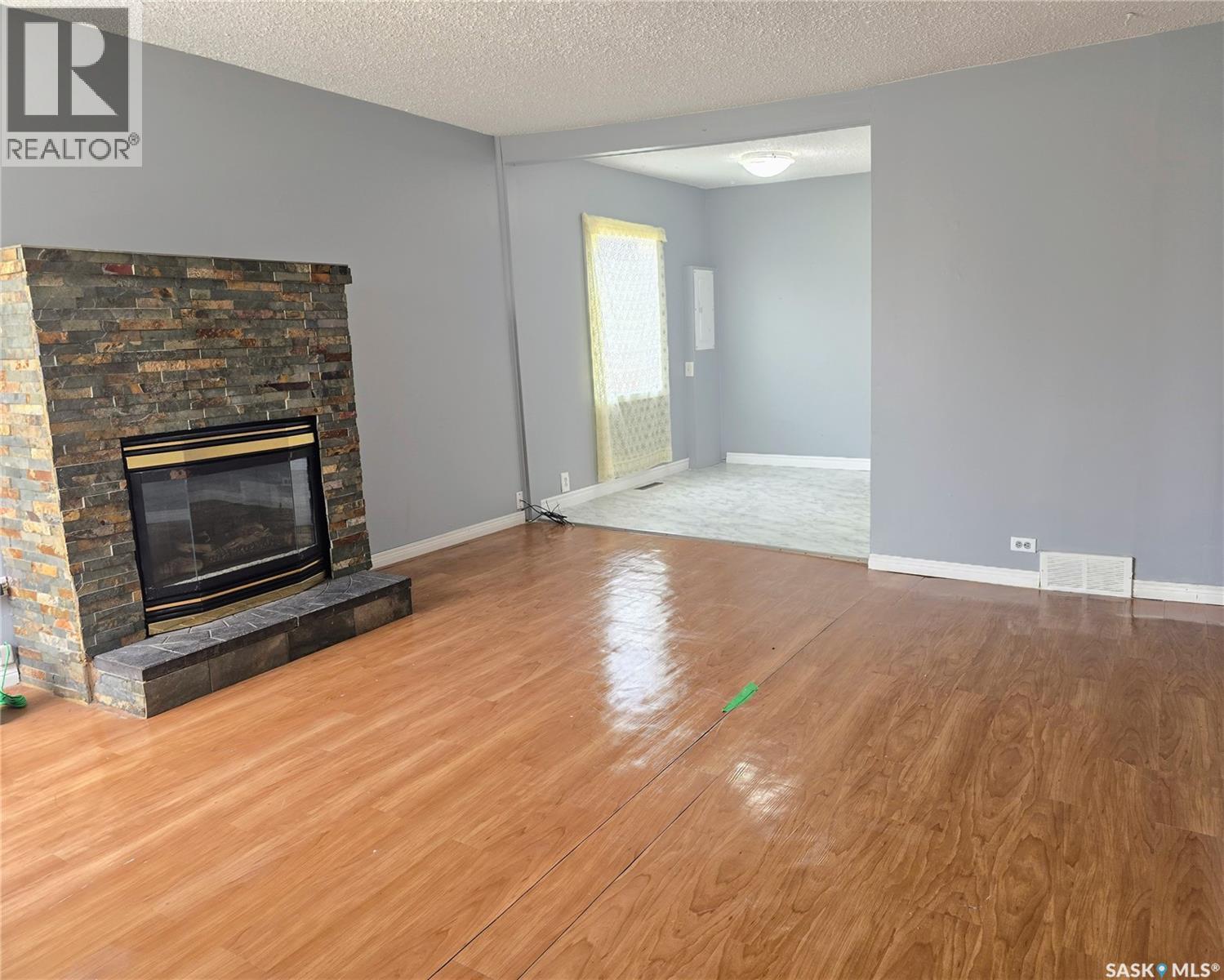 116 2Nd Avenue, Meacham, SK - Indoor Photo Showing Living Room With Fireplace