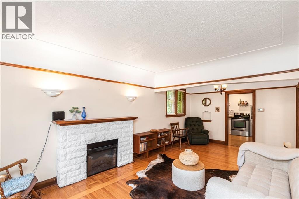 52 Cameron Avenue S, Hamilton, ON - Indoor Photo Showing Living Room With Fireplace