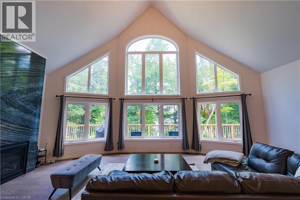 95 Chipmunk Lane, Magnetawan, ON - Indoor Photo Showing Living Room With Fireplace