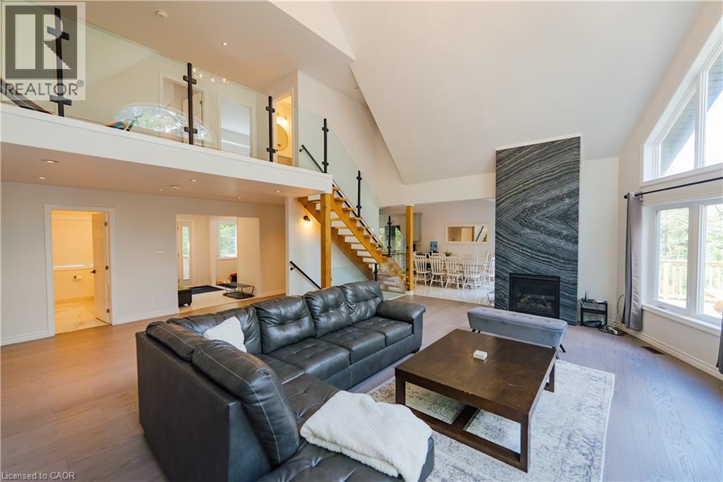 95 Chipmunk Lane, Magnetawan, ON - Indoor Photo Showing Living Room With Fireplace