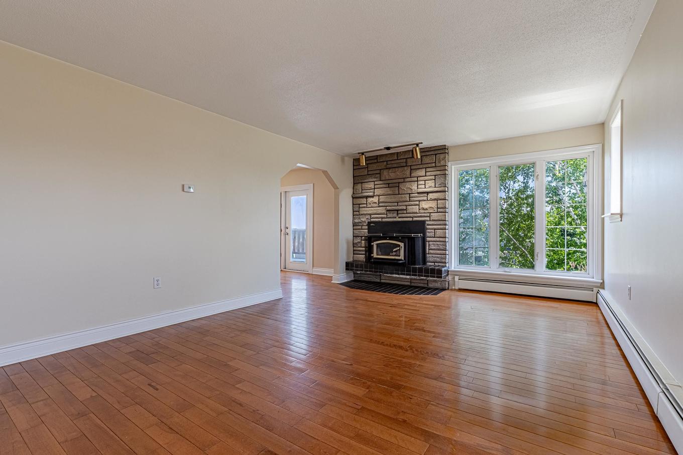 324 Kinlock Road, Stratford, PE - Indoor Photo Showing Living Room With Fireplace