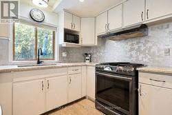 Gas Stove with Steel looking Back Splash -