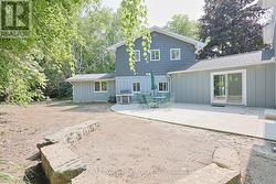 Back of the home with patio area -