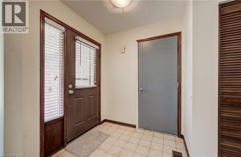 Tiled foyer and entry to garage. - 197 Southwood Drive, Kitchener, ON - Indoor Photo Showing Other Room