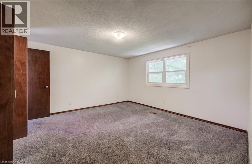 Primary bedroom facing rear with twin closets. Ensuite privilege. - 197 Southwood Drive, Kitchener, ON - Indoor Photo Showing Other Room
