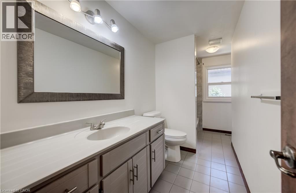 This is a deep bathroom. newer window. - 197 Southwood Drive, Kitchener, ON - Indoor Photo Showing Bathroom