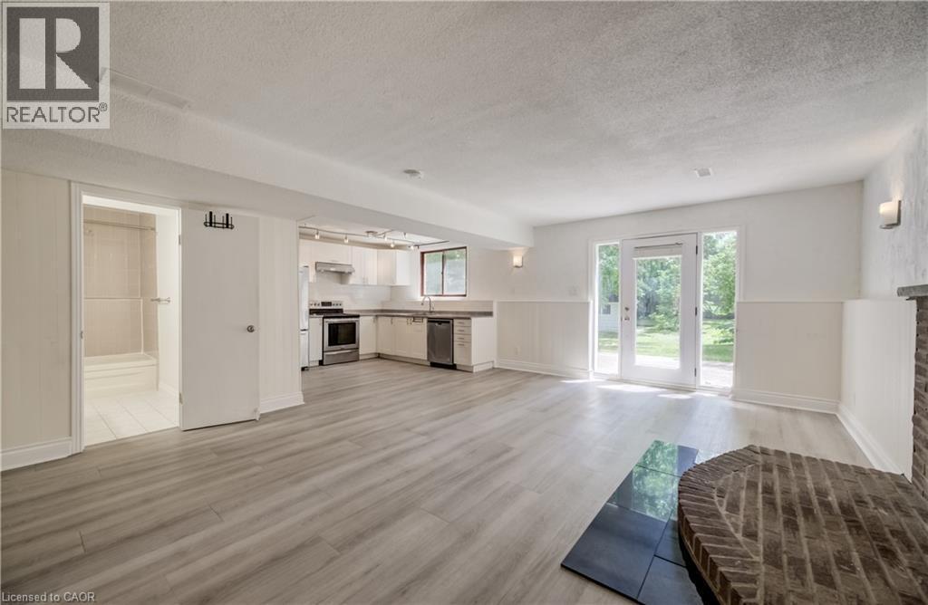Laminate flooring throughout lower level. - 197 Southwood Drive, Kitchener, ON - Indoor With Fireplace