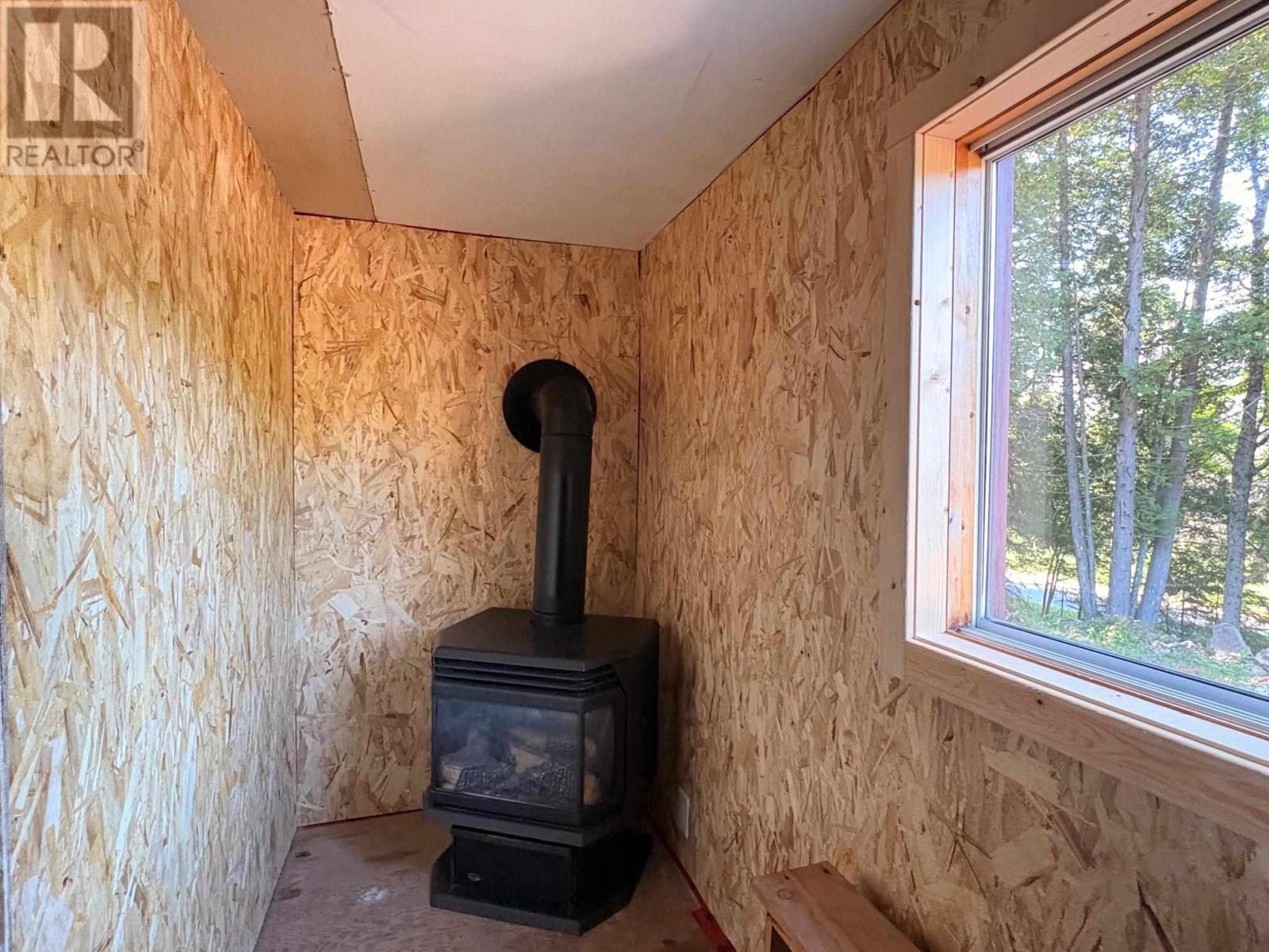 3235 Walnut St, Hilton Beach, ON - Indoor With Fireplace
