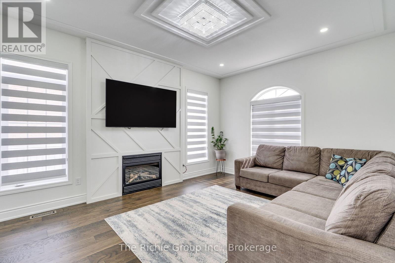 Family room - 59 Tarquini Crescent, Caledon, ON - Indoor Photo Showing Living Room With Fireplace