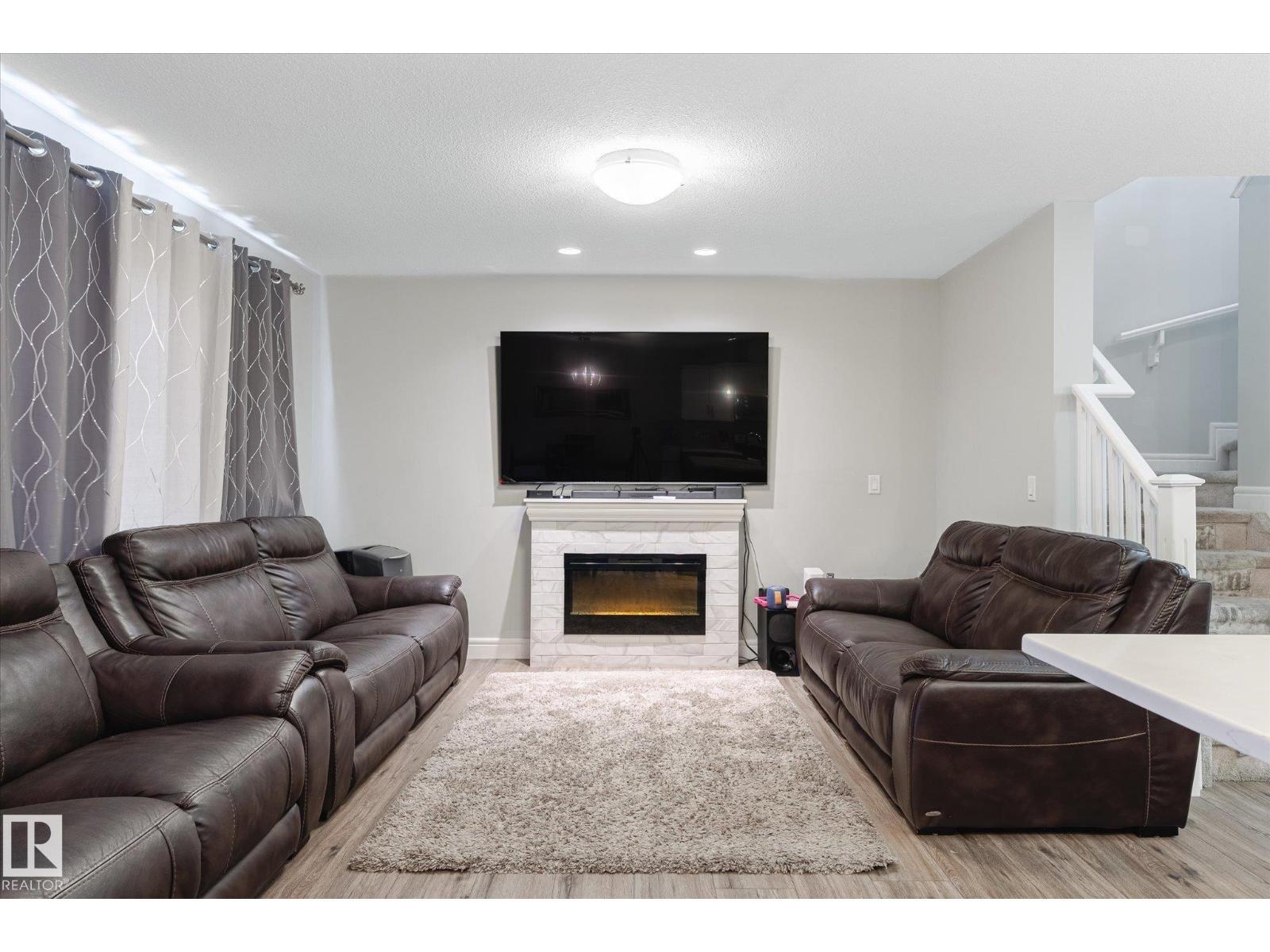 1416 169 St Sw, Edmonton, AB - Indoor Photo Showing Living Room With Fireplace