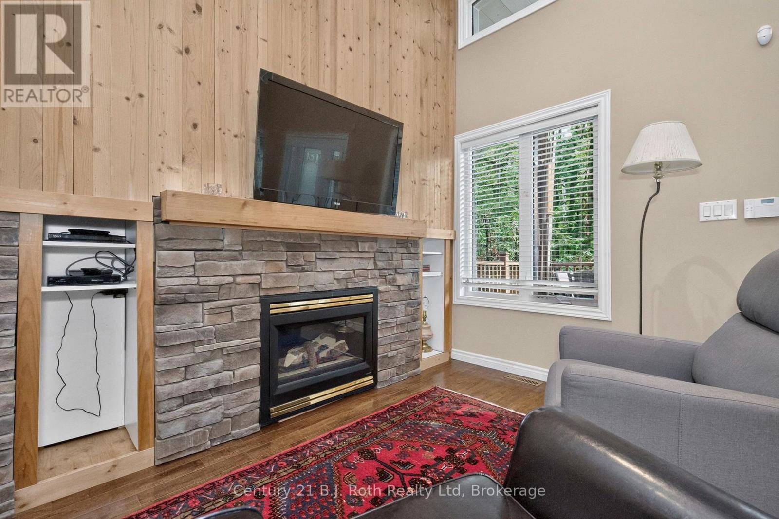 11 Rue Karola Road, Tiny, ON - Indoor Photo Showing Living Room With Fireplace