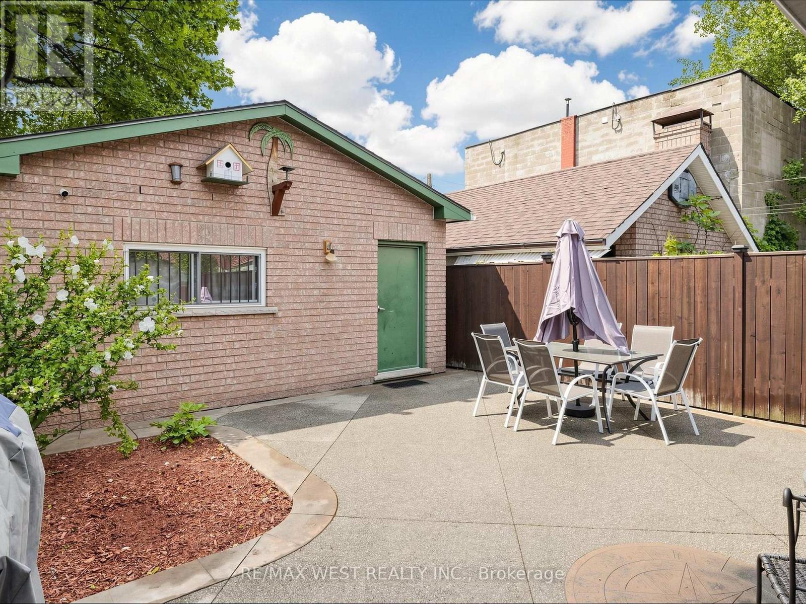 Exposed Aggregate Wraparound Walkway & Backyard - 335 East Avenue N, Hamilton, ON - Outdoor With Exterior