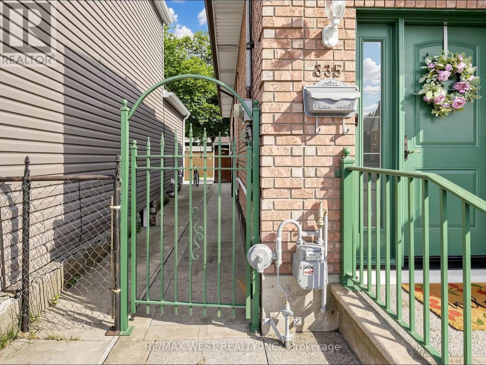 Iron Fence with Gate - 335 East Avenue N, Hamilton, ON - Outdoor With Exterior