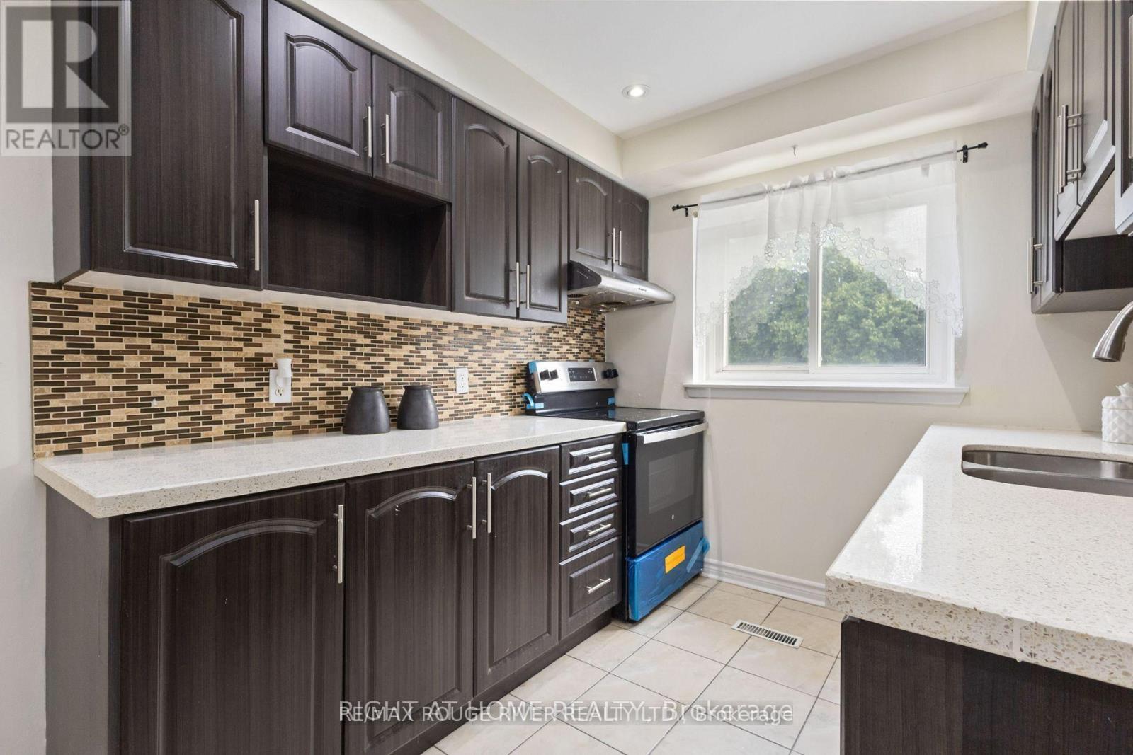 Modern Upgraded Kitchen - 77 Lowry Square, Toronto, ON - Indoor Photo Showing Kitchen With Double Sink